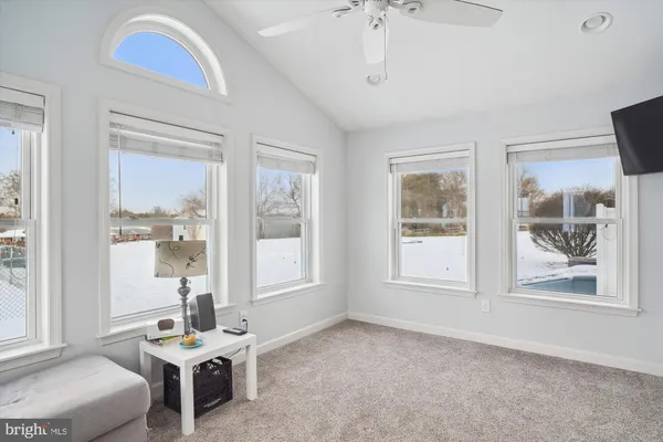 a bathroom with a granite countertop sink and a large mirror