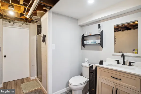 a view of a storage & utility room with dryer and washer
