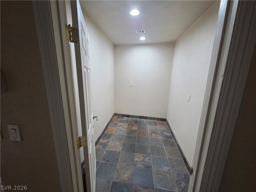 3381 Westwind Road Las Vegas, NV 89146 - Photo 31 of 52 A compact storage space with resilient tile flooring, illuminated by recessed lighting.