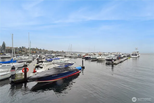 a white house with lawn chairs