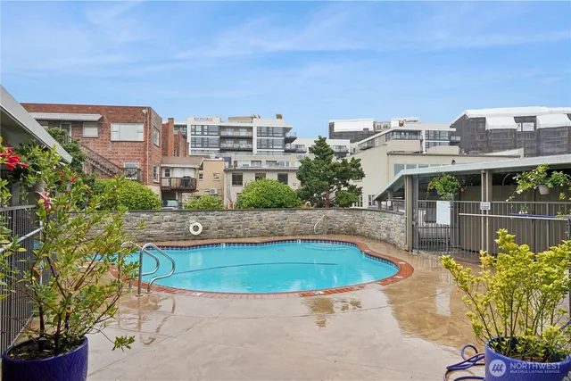 a view of a swimming pool with a patio