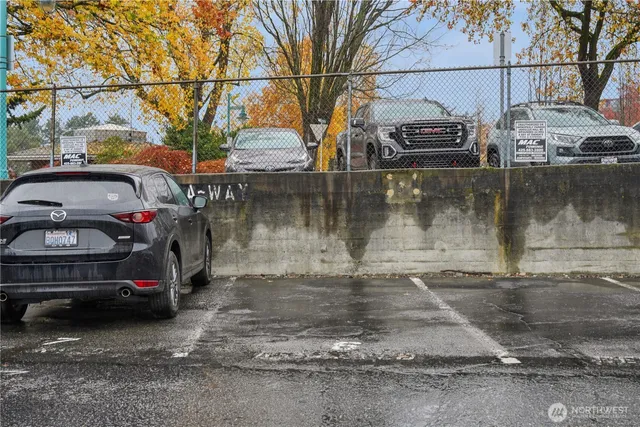 a view of a car parked on the side of a street