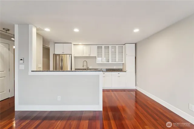 a view of kitchen with wooden floor