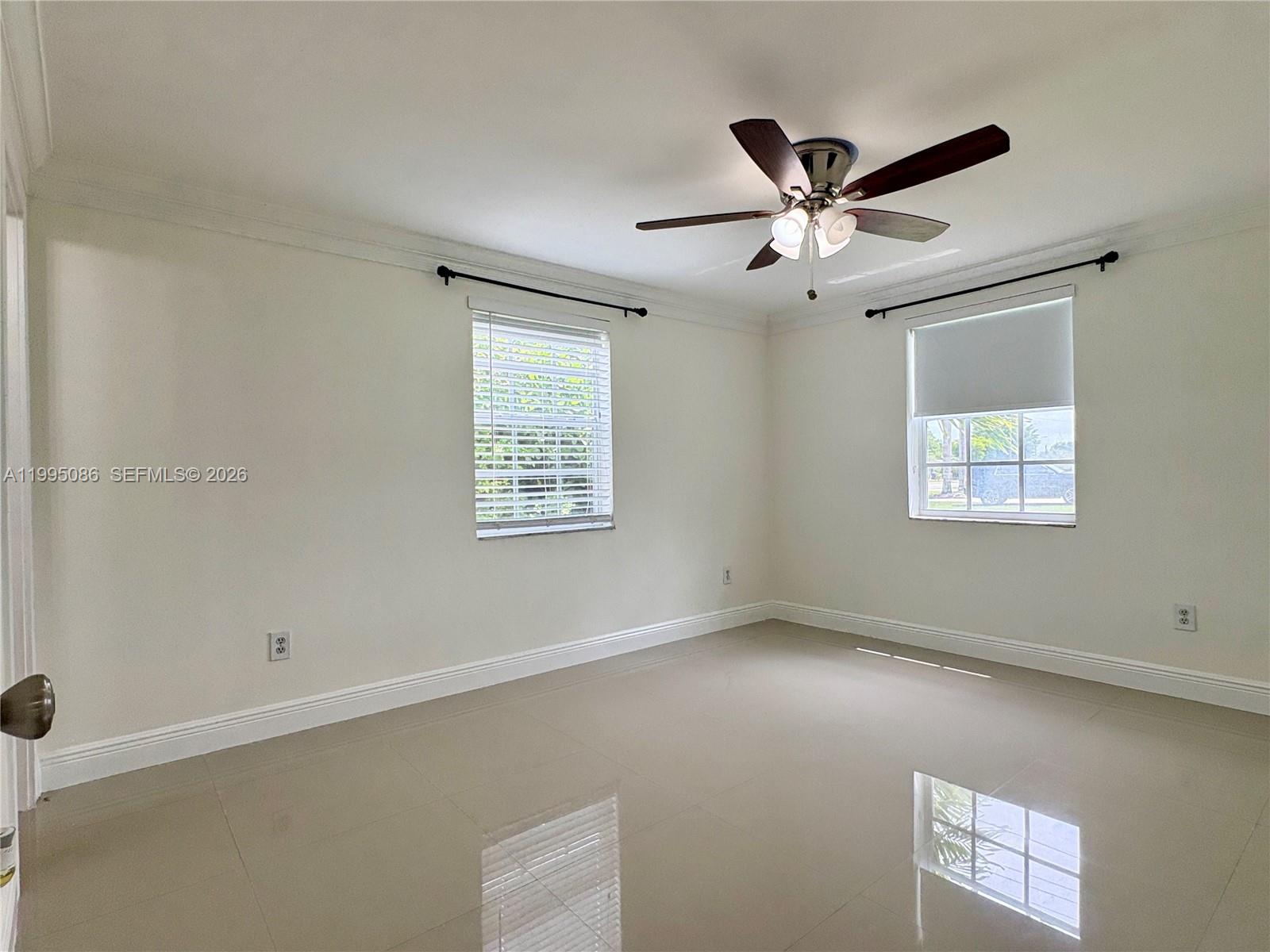 11315 Southwest 58th Terrace Miami, FL 33173 - Photo 15 of 26 a view of an empty room with a window