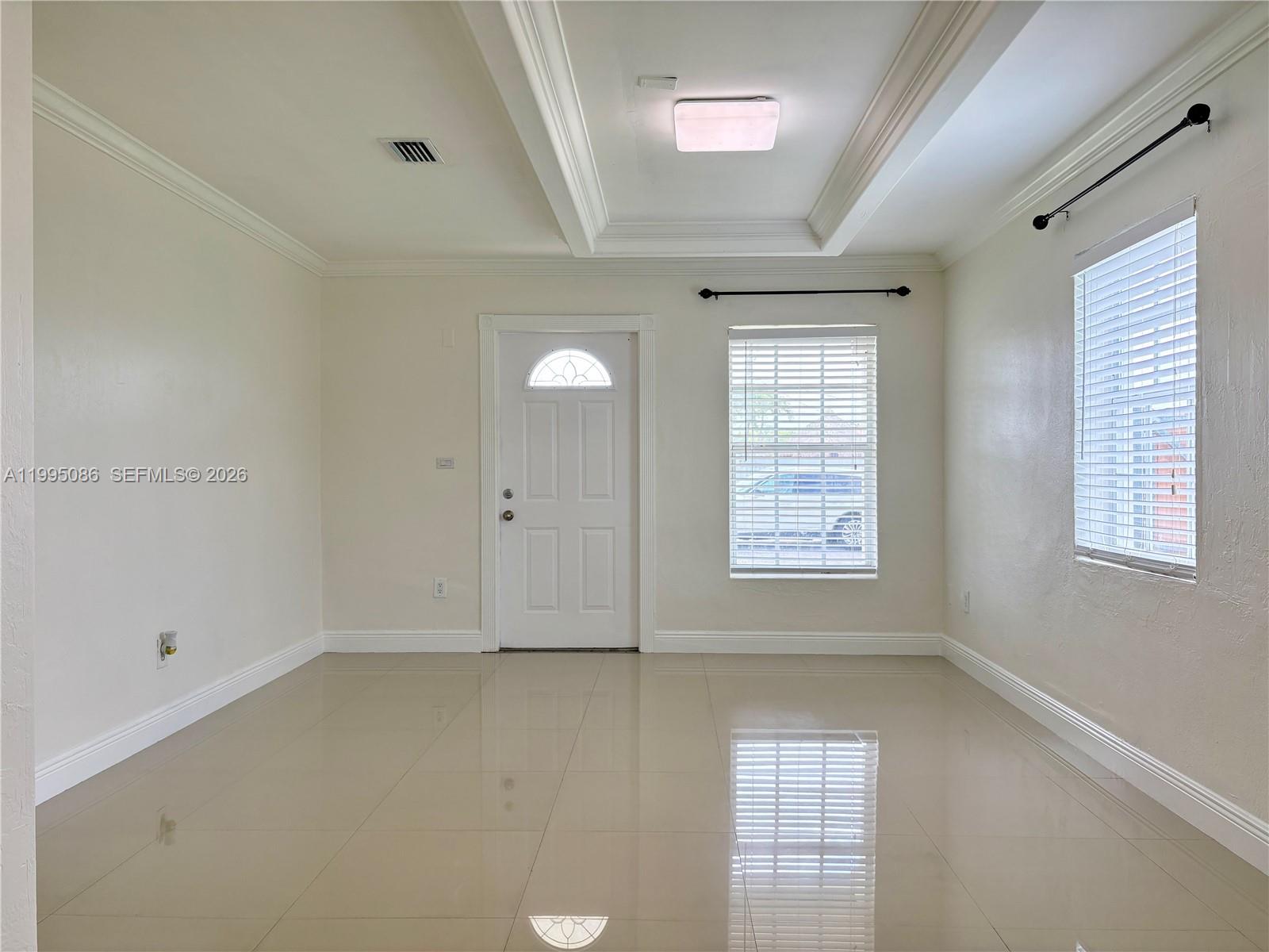 11315 Southwest 58th Terrace Miami, FL 33173 - Photo 5 of 26 a view of an empty room with a window