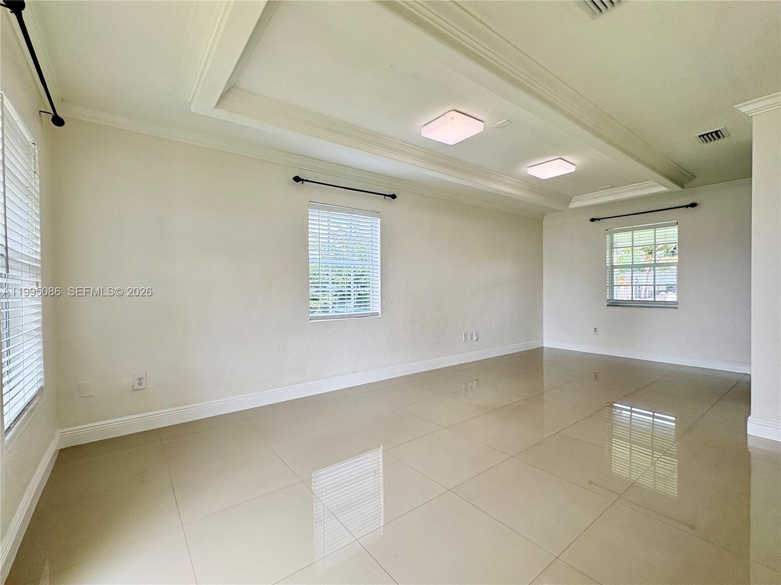 11315 Southwest 58th Terrace Miami, FL 33173 - Photo 7 of 26 a view of an empty room with a window