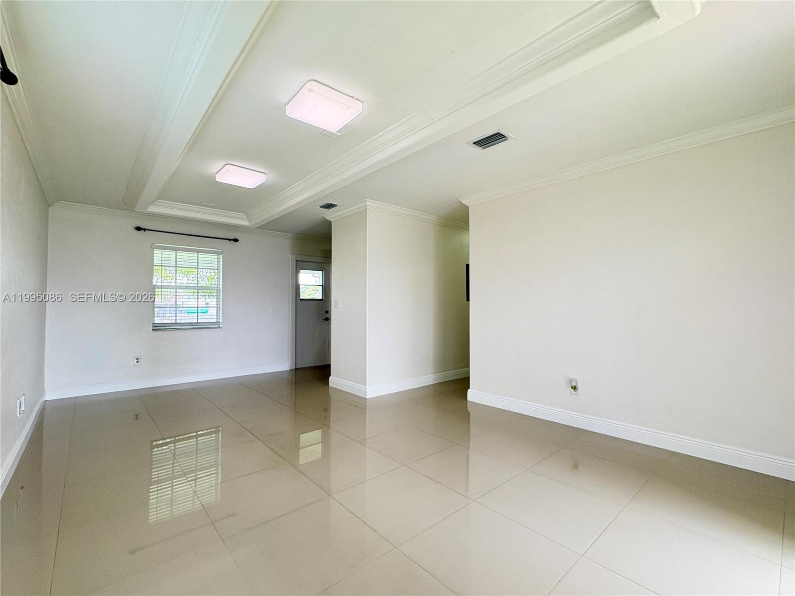 11315 Southwest 58th Terrace Miami, FL 33173 - Photo 8 of 26 a view of an empty room with a window