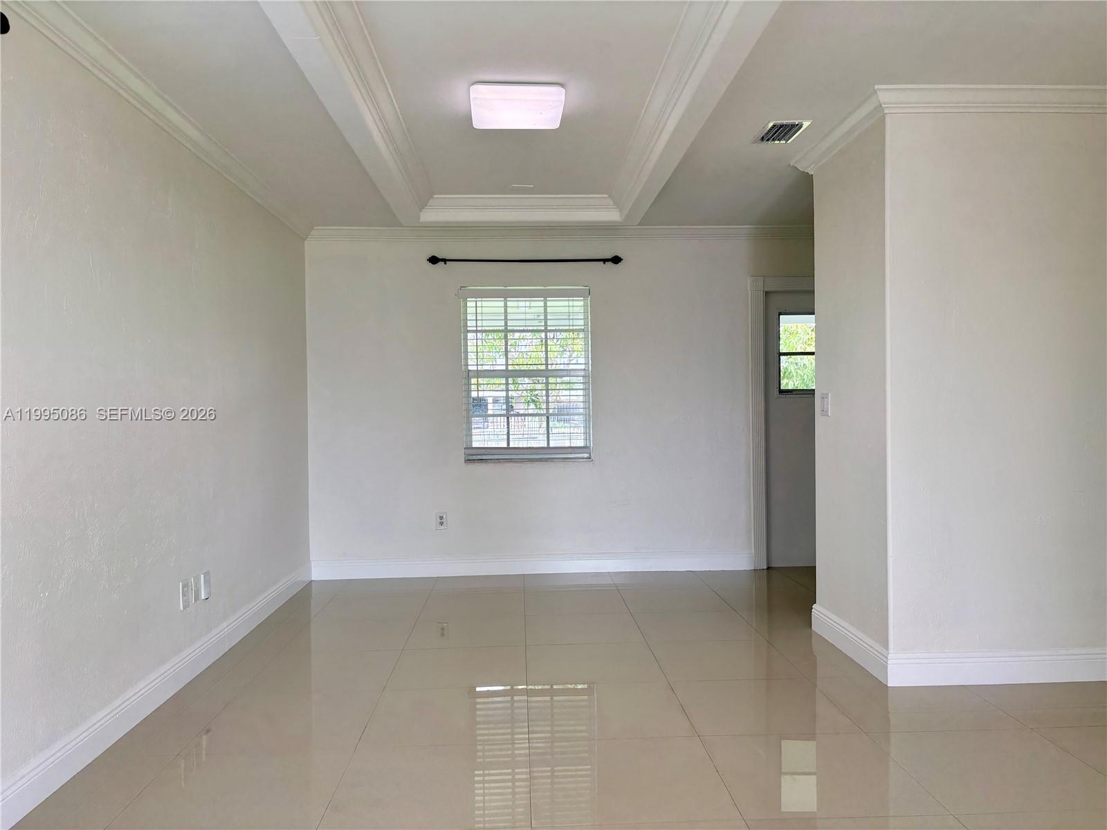 11315 Southwest 58th Terrace Miami, FL 33173 - Photo 9 of 26 an empty room with windows