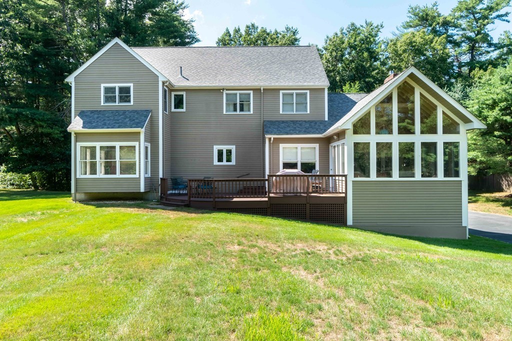 584 Dutton Road Sudbury, MA 01776 - Photo 26 of 29 a front view of a house with yard