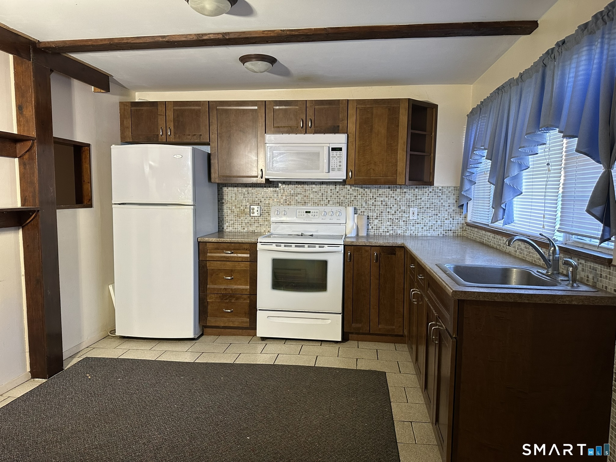 55 Porter Avenue, Unit 6E Naugatuck, CT 06770 - Photo 4 of 12 a kitchen with a sink a stove and refrigerator