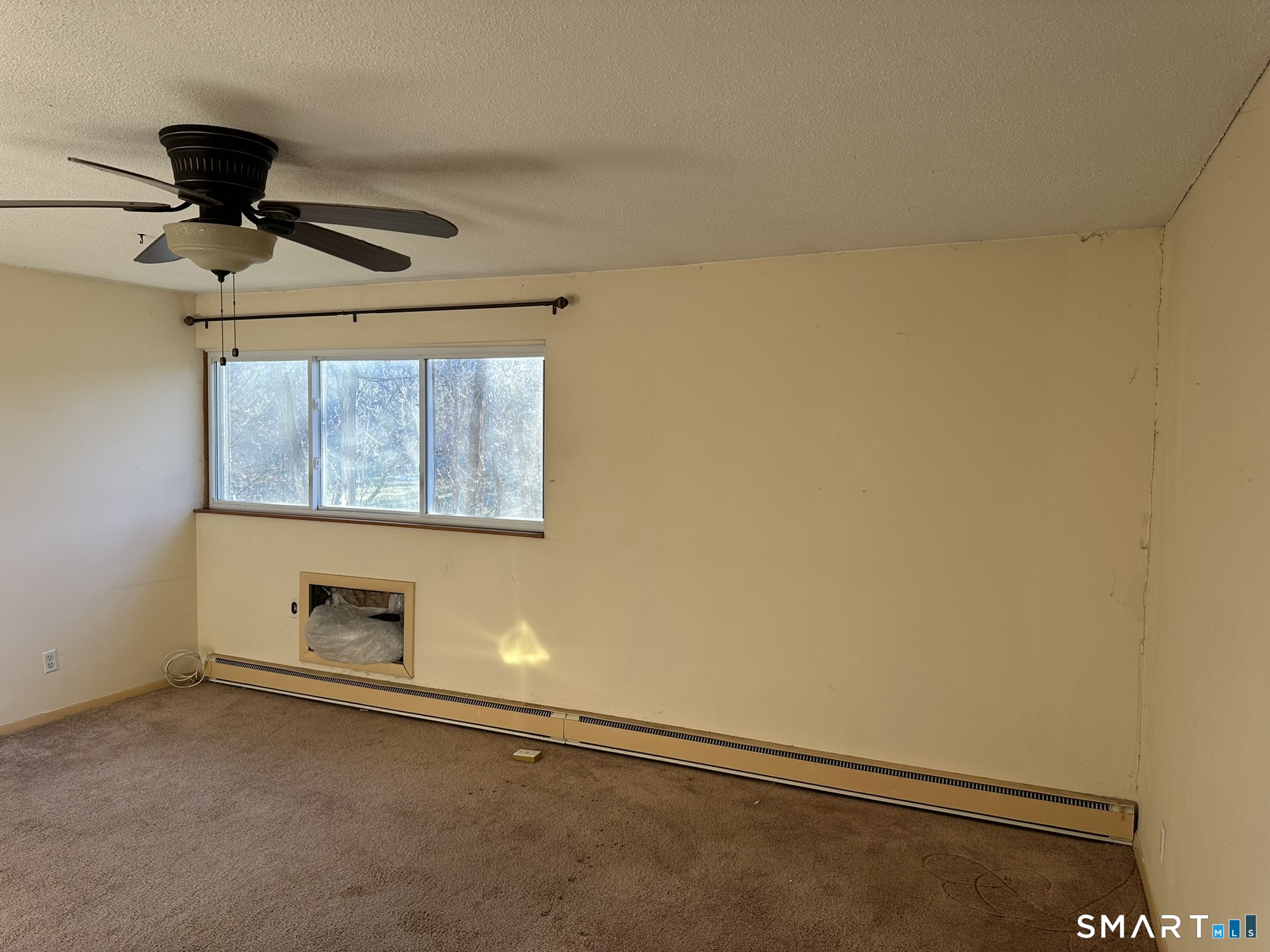55 Porter Avenue, Unit 6E Naugatuck, CT 06770 - Photo 9 of 12 a room with a wooden floor and white wall
