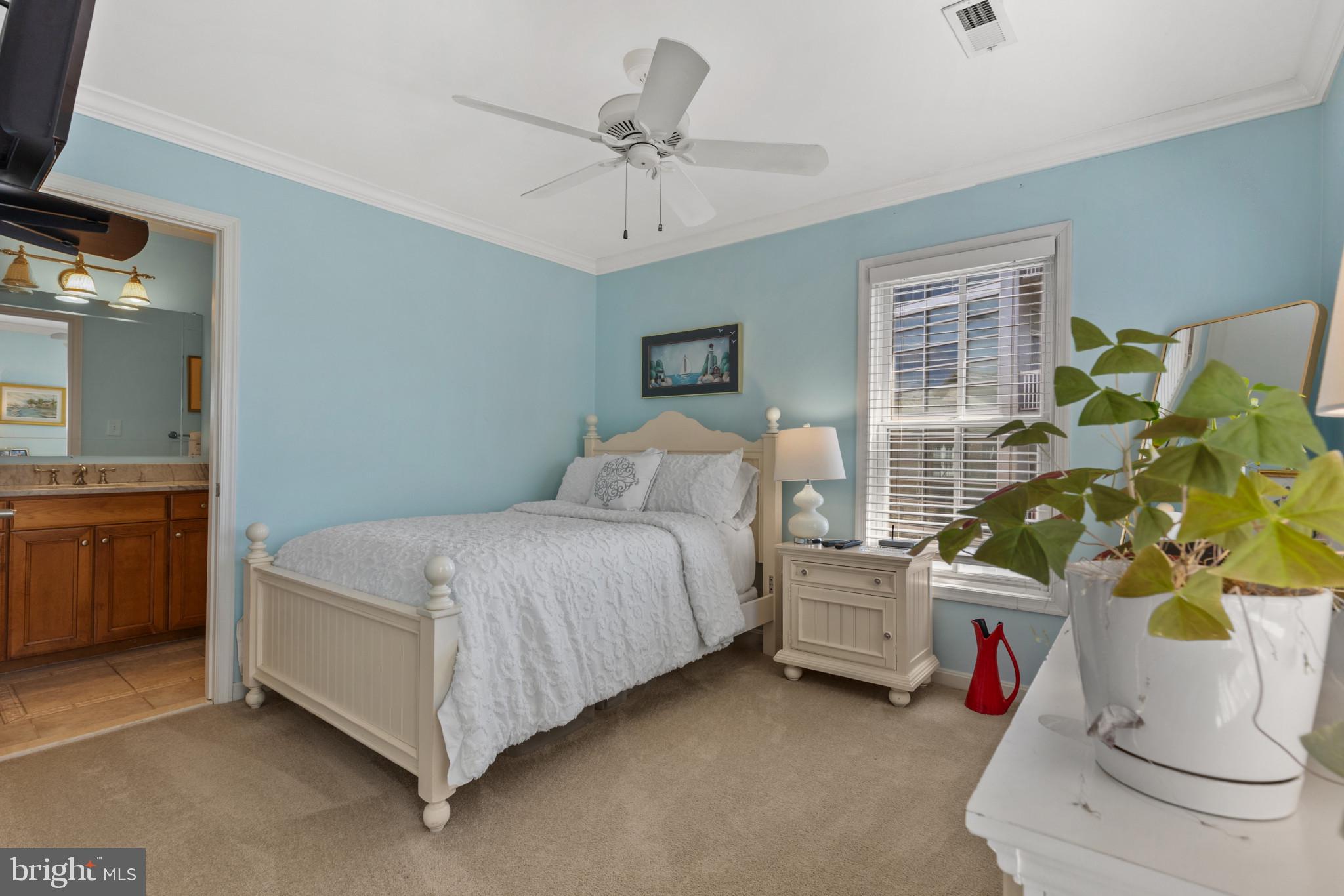 1262 Dockside Circle Baltimore, MD 21224 - Photo 13 of 35 a bedroom with a bed and a window