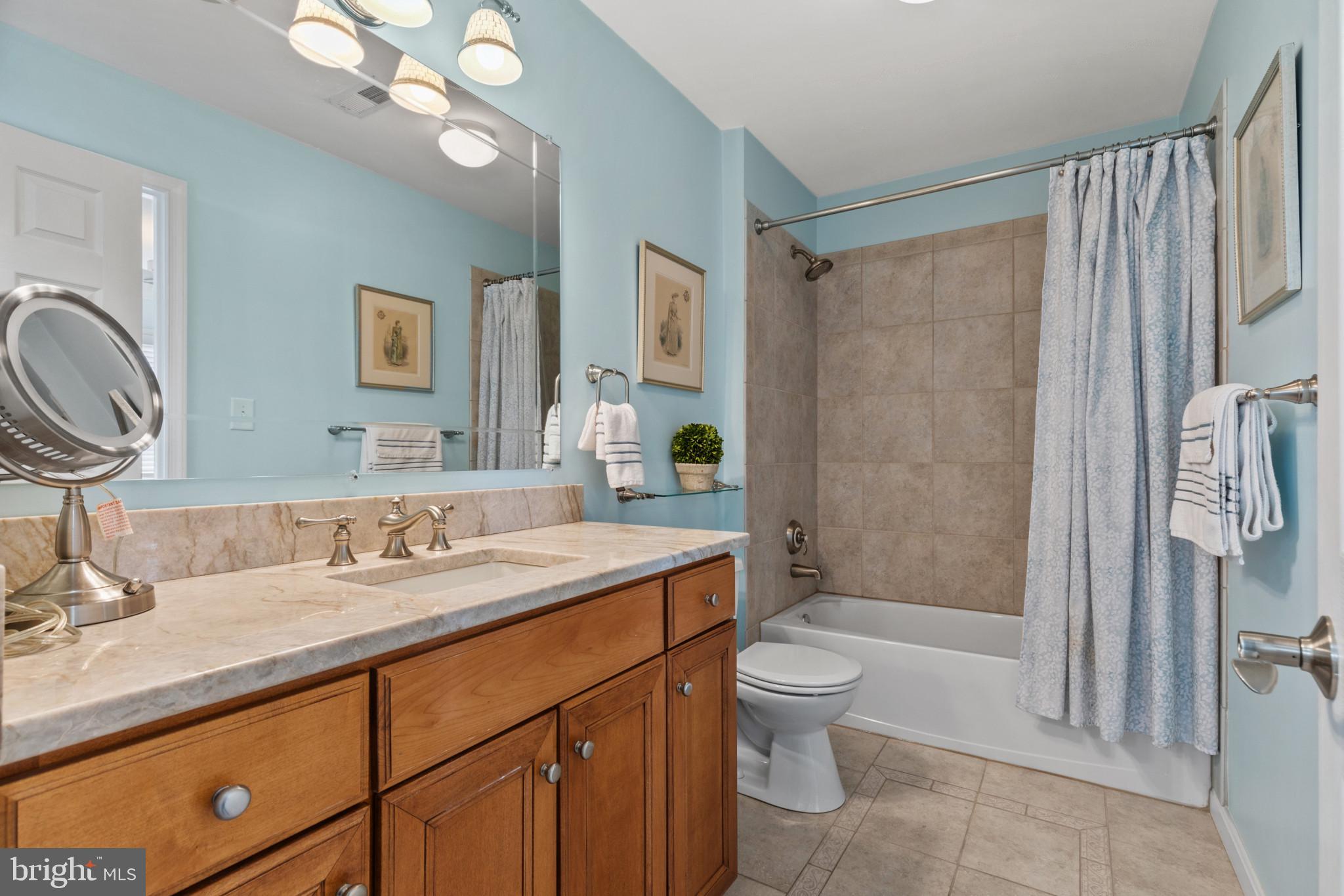 1262 Dockside Circle Baltimore, MD 21224 - Photo 15 of 35 a bathroom with a sink a toilet and shower