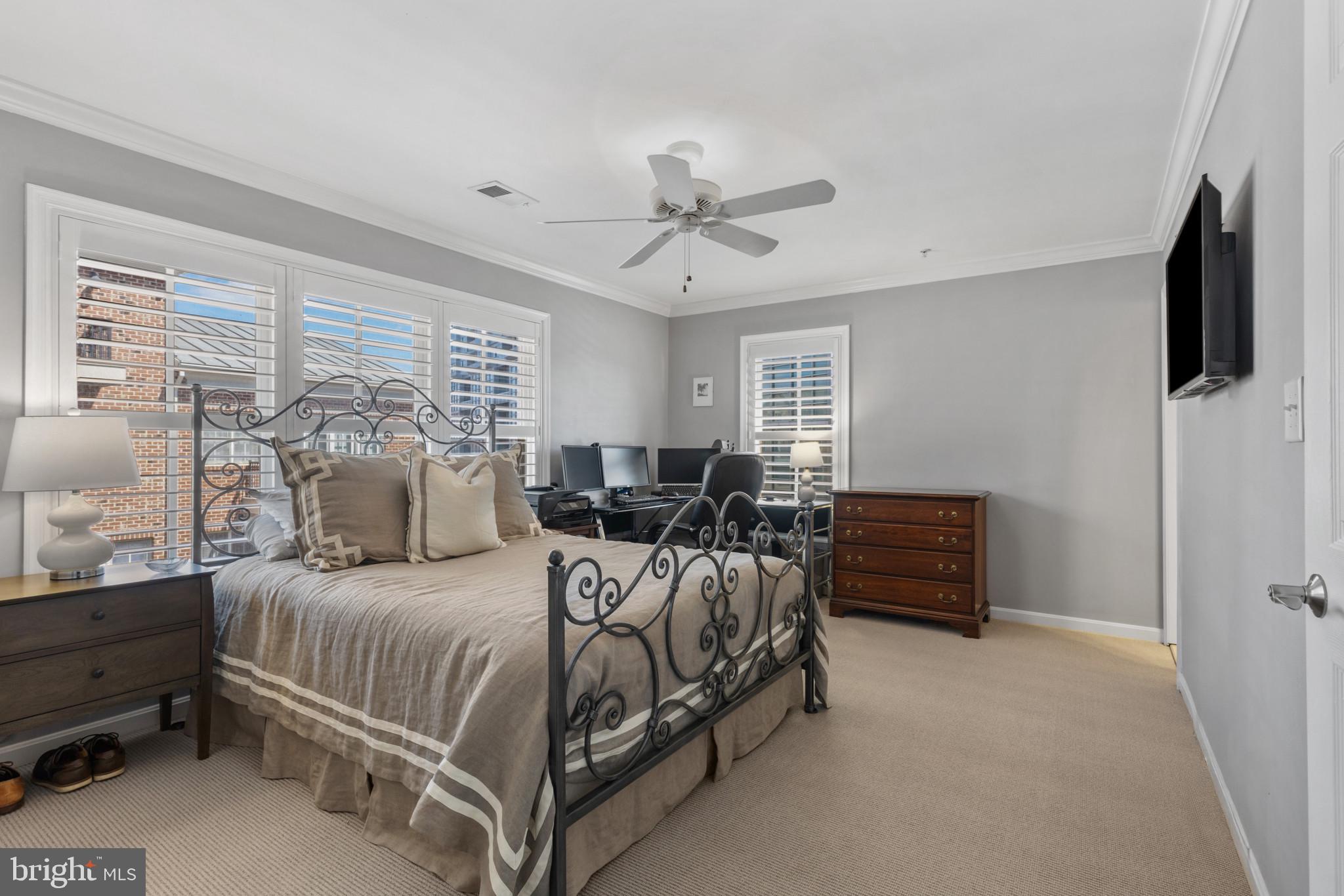 1262 Dockside Circle Baltimore, MD 21224 - Photo 16 of 35 a bedroom with a bed and a chandelier