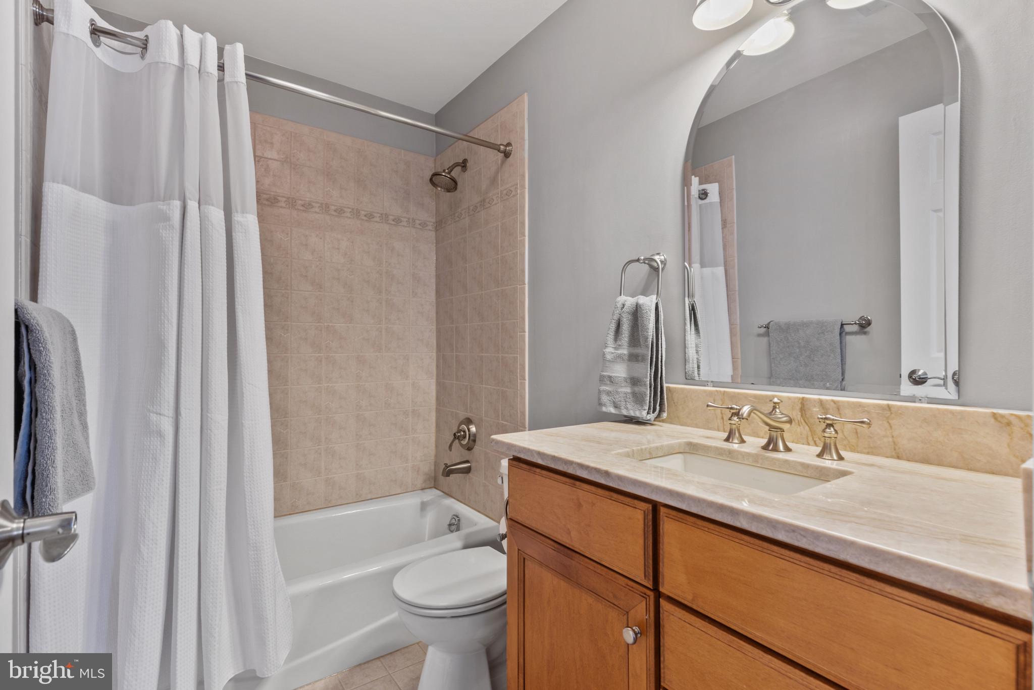 1262 Dockside Circle Baltimore, MD 21224 - Photo 18 of 35 a bathroom with a sink toilet double vanity and shower