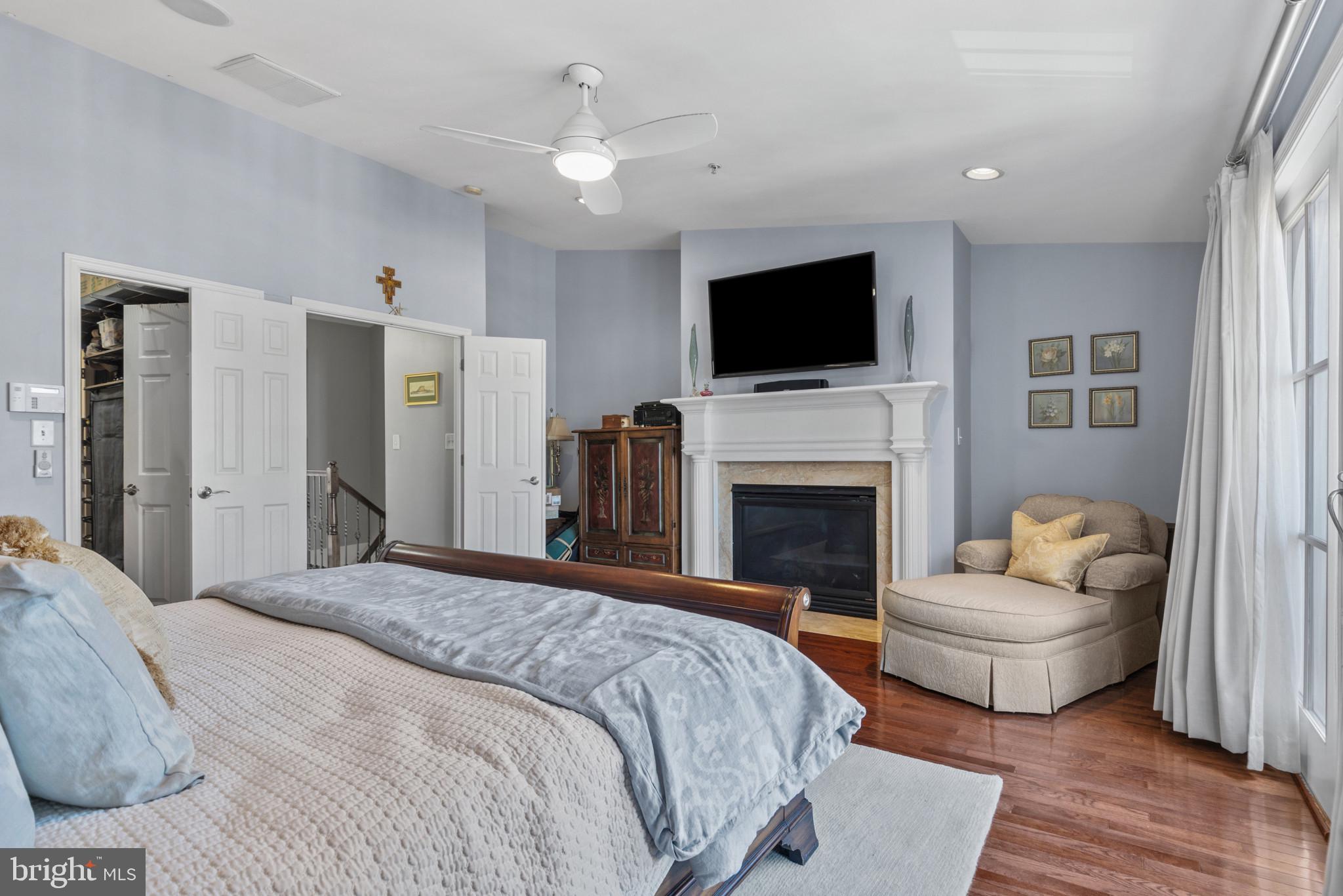 1262 Dockside Circle Baltimore, MD 21224 - Photo 21 of 35 a bedroom with a bed and a flat screen tv