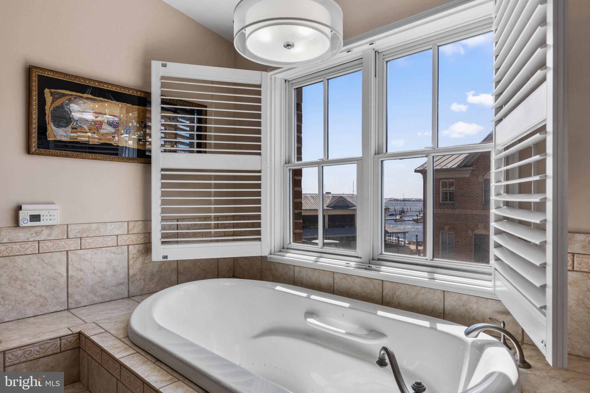 1262 Dockside Circle Baltimore, MD 21224 - Photo 25 of 35 a bath tub sitting next to a window