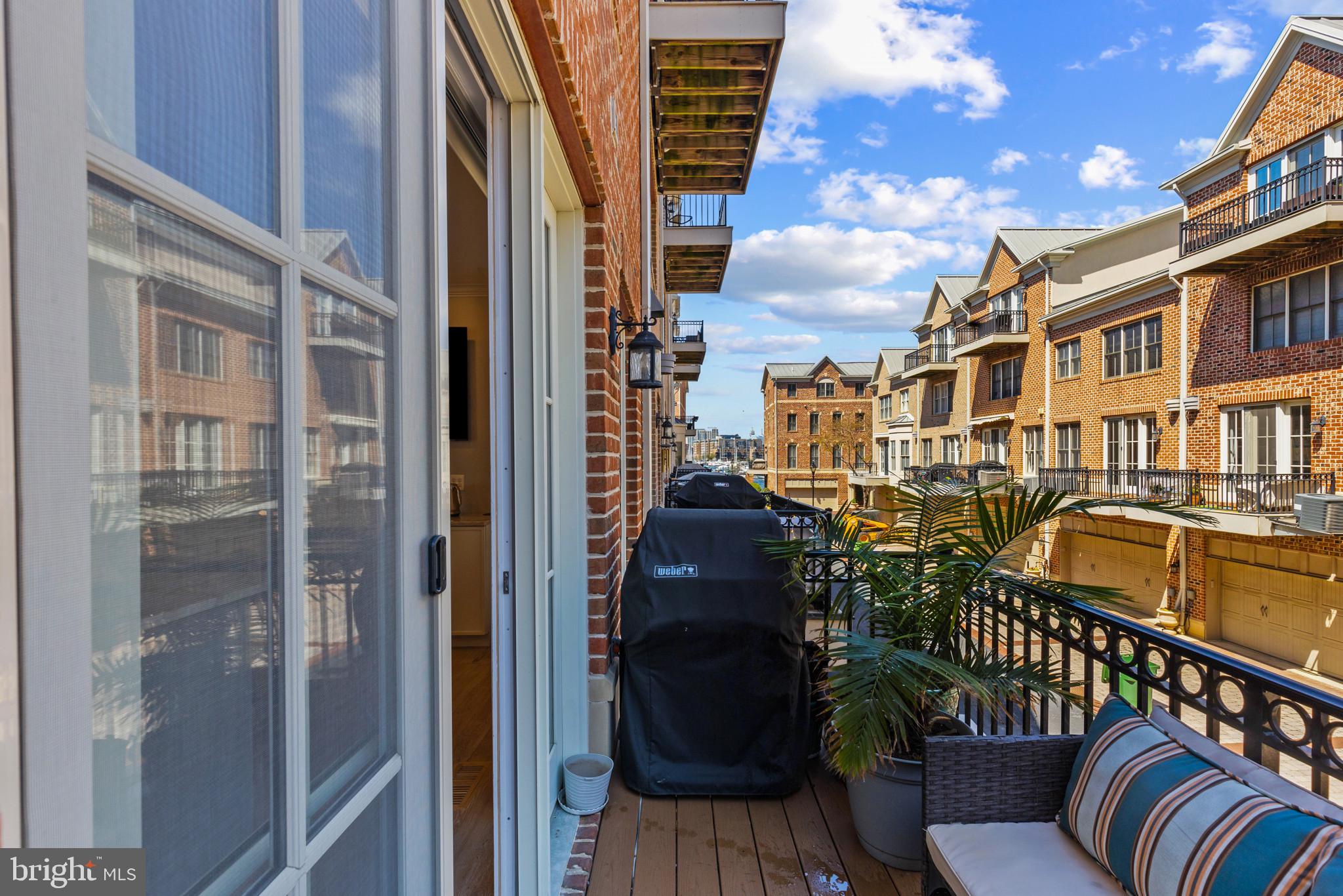 1262 Dockside Circle Baltimore, MD 21224 - Photo 26 of 35 a view of a balcony with chairs