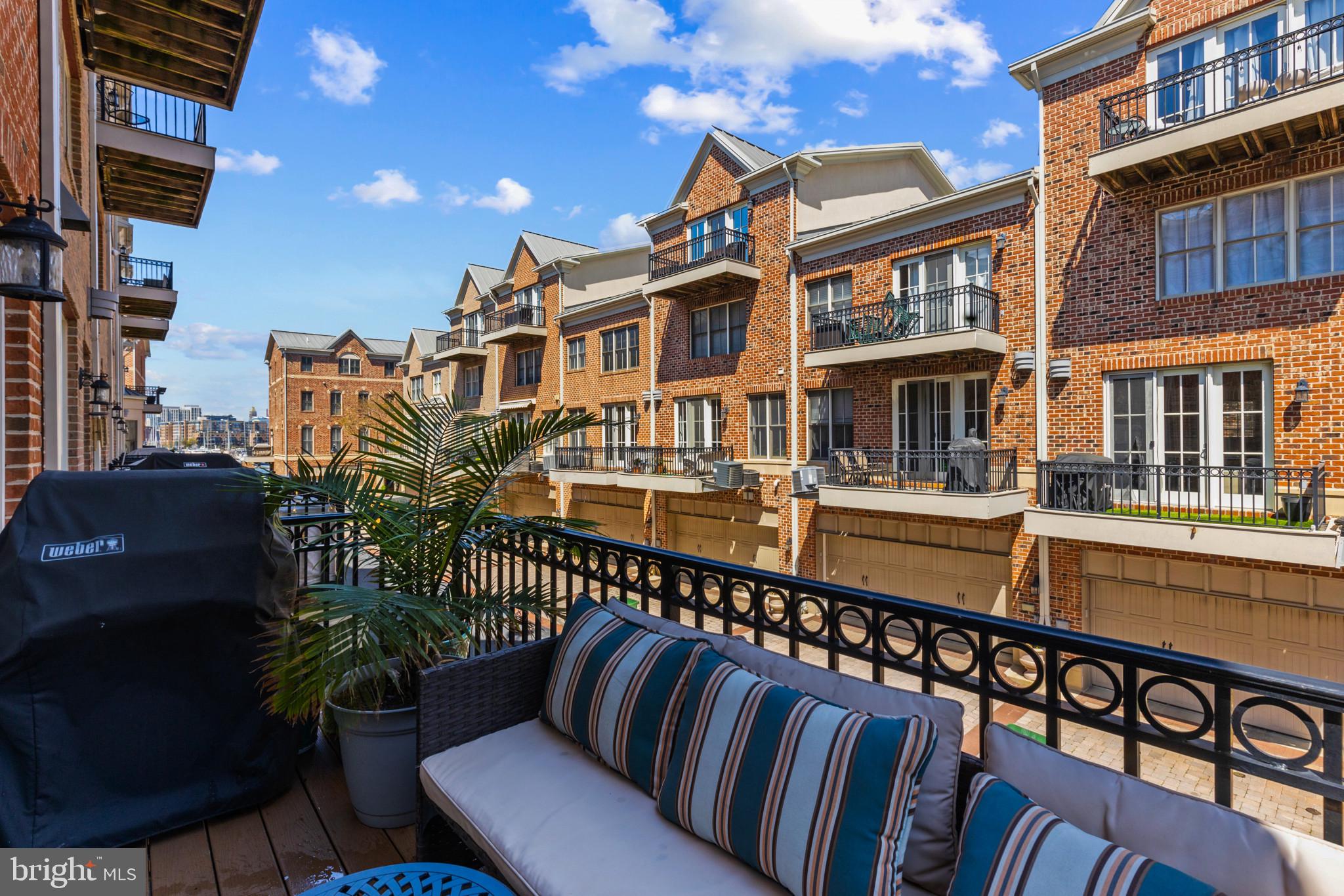 1262 Dockside Circle Baltimore, MD 21224 - Photo 27 of 35 a balcony with outdoor seating and stairs
