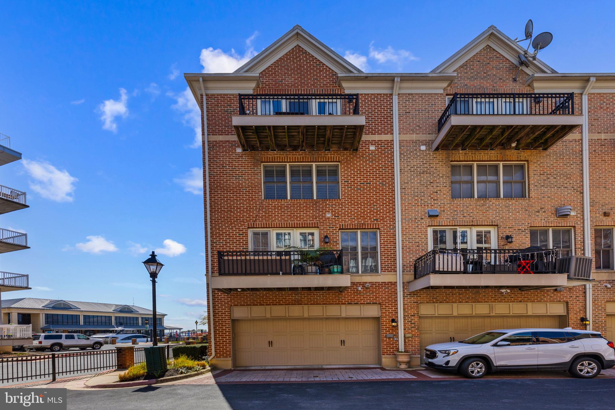 1262 Dockside Circle Baltimore, MD 21224 - Photo 33 of 35 a front view of a house with parking