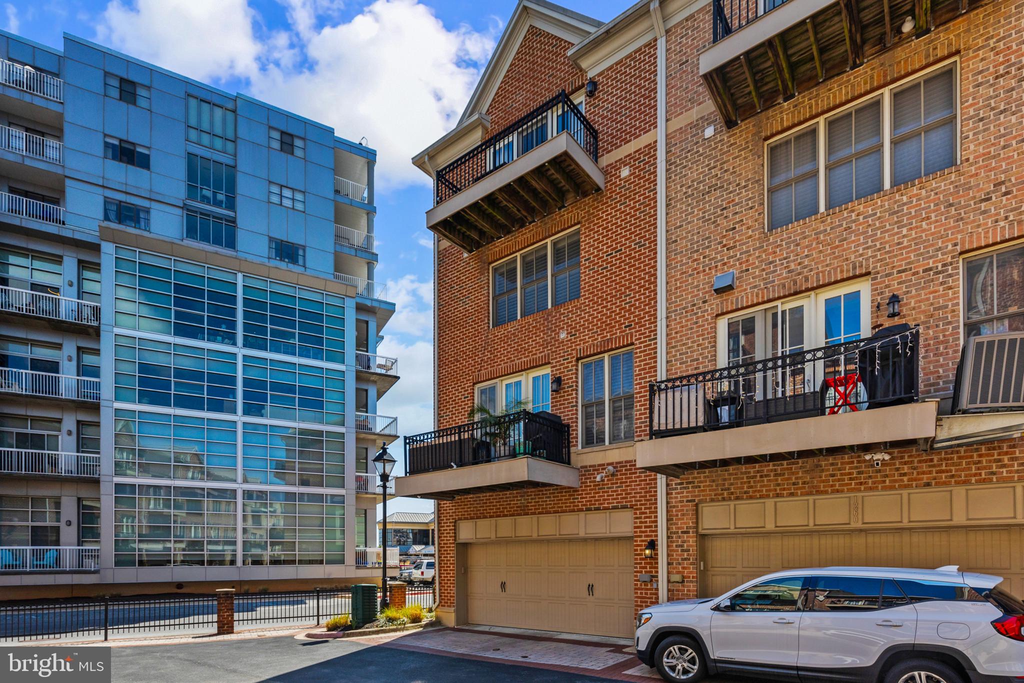 1262 Dockside Circle Baltimore, MD 21224 - Photo 34 of 35 a front view of a building with parking space