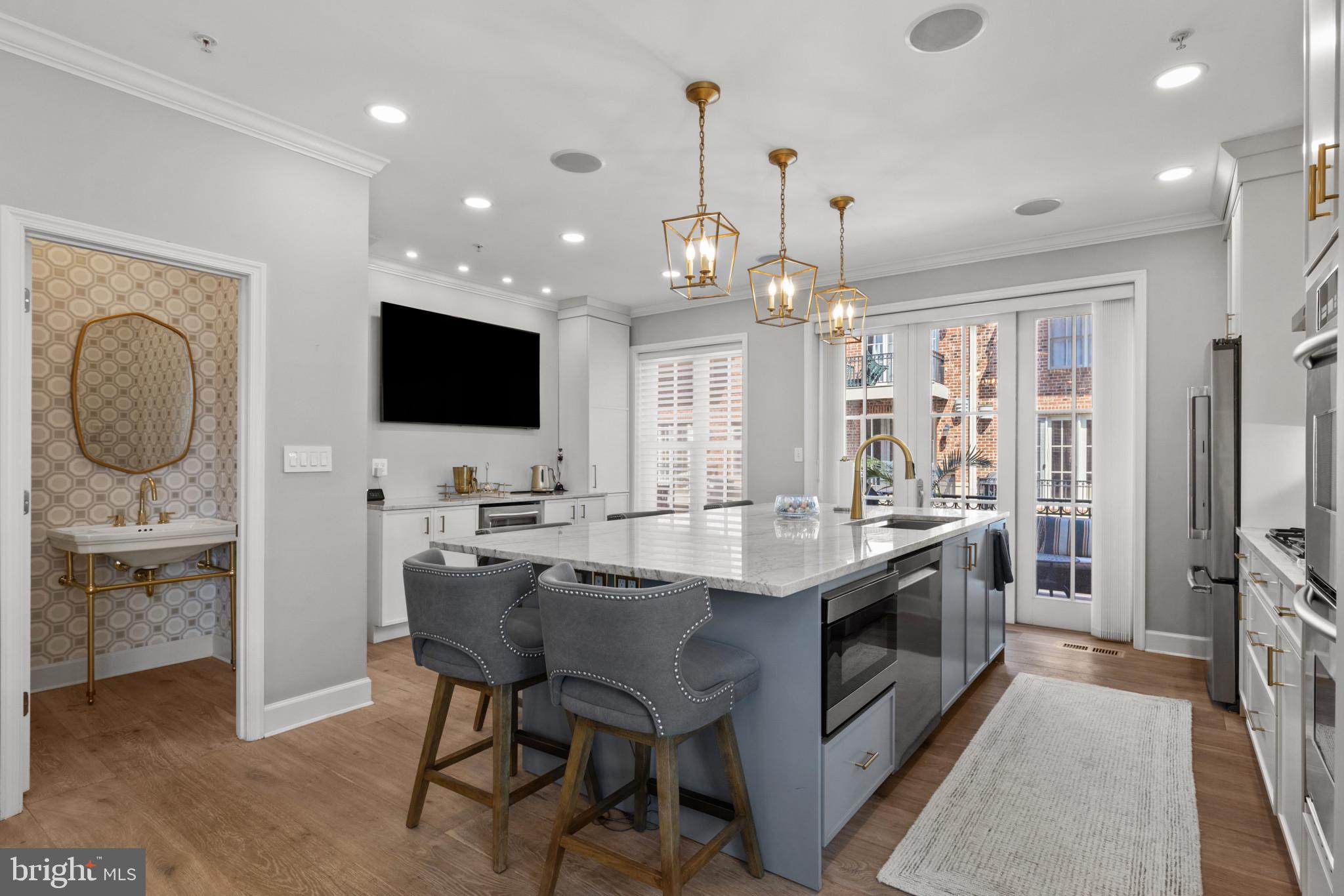 1262 Dockside Circle Baltimore, MD 21224 - Photo 7 of 35 a kitchen with stainless steel appliances granite countertop a stove and a refrigerator