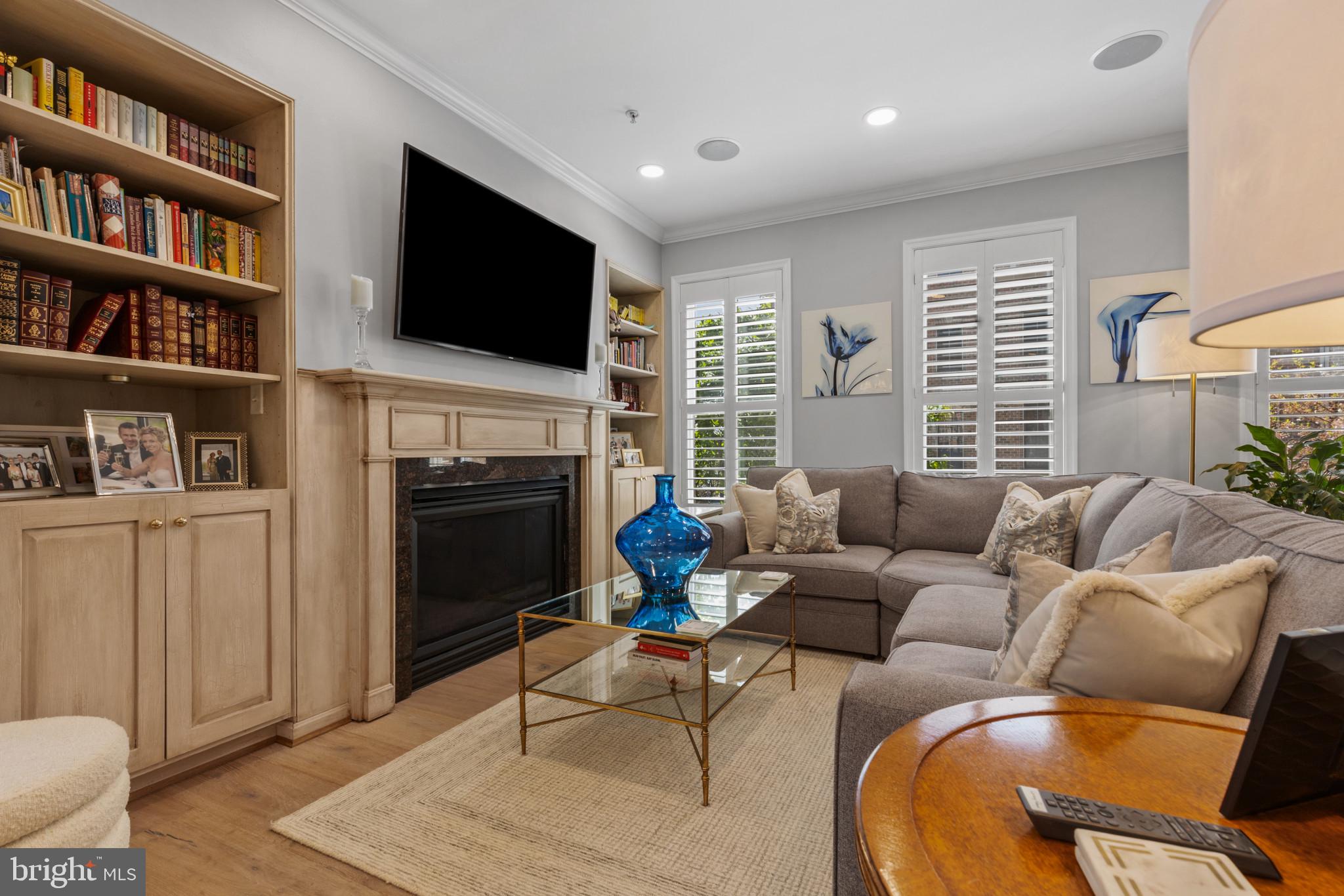 1262 Dockside Circle Baltimore, MD 21224 - Photo 10 of 35 a living room with furniture a flat screen tv and a fireplace