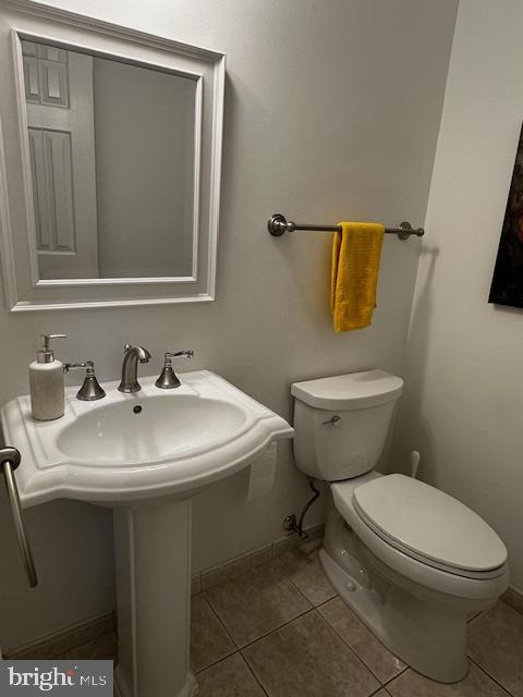 8229 Bell Lane Vienna, VA 22182 - Photo 13 of 41 a white toilet sitting next to a bathroom sink