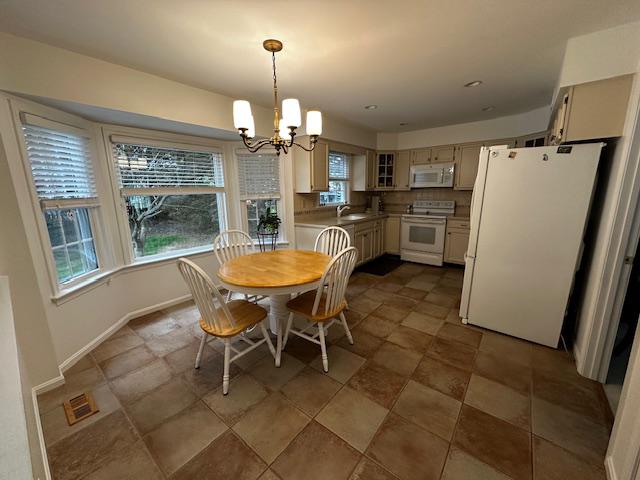 8229 Bell Lane Vienna, VA 22182 - Photo 19 of 41 a dining room with furniture a chandelier and wooden floor