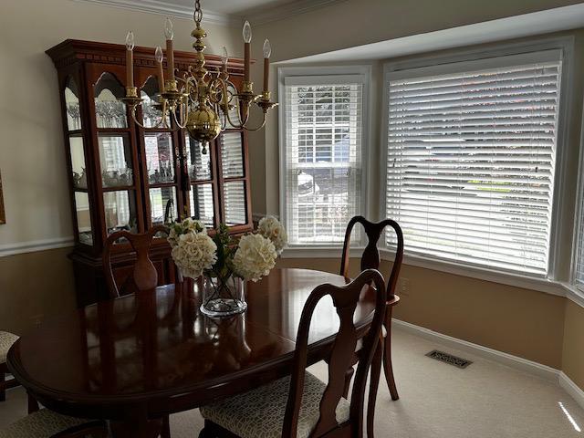 8229 Bell Lane Vienna, VA 22182 - Photo 27 of 41 a view of a dining room with furniture and window
