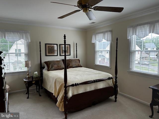 8229 Bell Lane Vienna, VA 22182 - Photo 31 of 41 a bedroom with a bed lamp and window