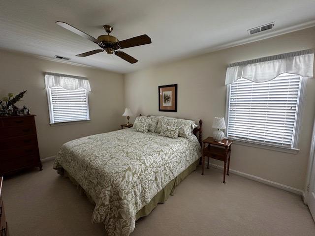 8229 Bell Lane Vienna, VA 22182 - Photo 34 of 41 a bed sitting in a bedroom next to a window