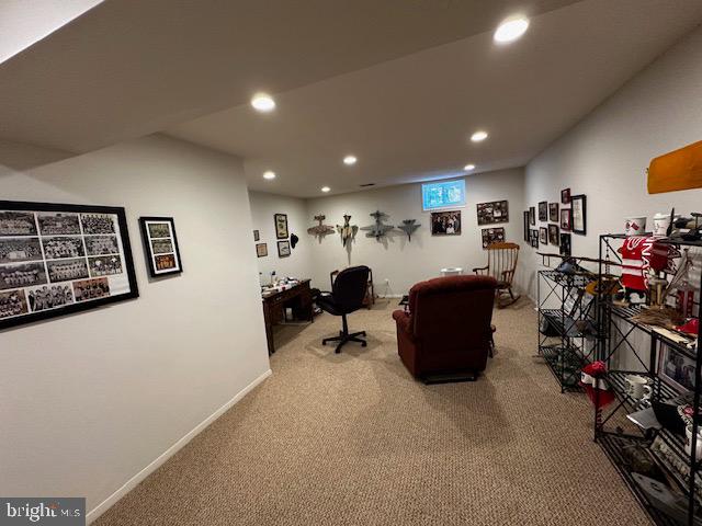 8229 Bell Lane Vienna, VA 22182 - Photo 38 of 41 a living room with lots of furniture and gym equipment