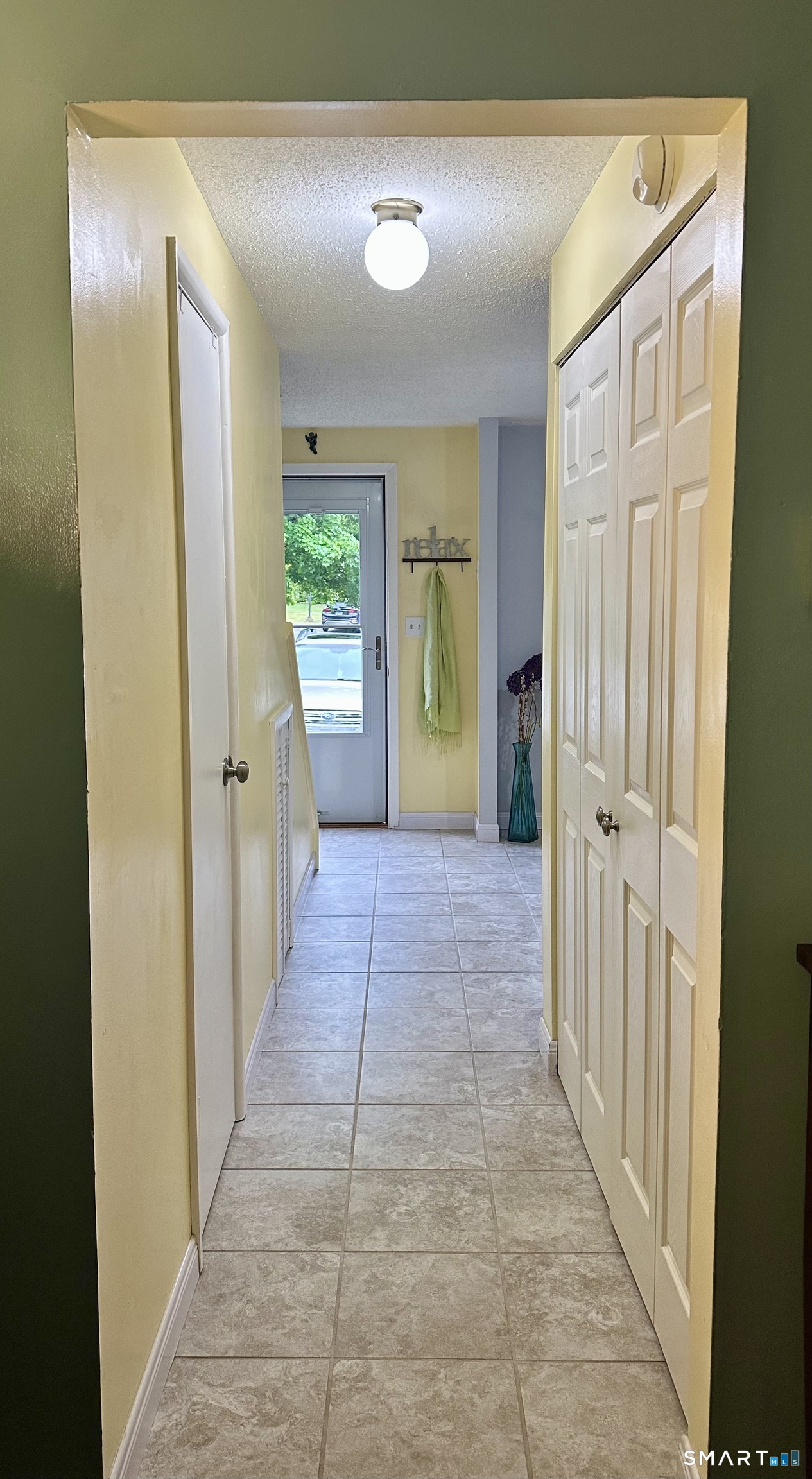 2 Lakeside Drive, Unit M Ledyard, CT 06339 - Photo 13 of 38 a view of a hallway with wooden shelves