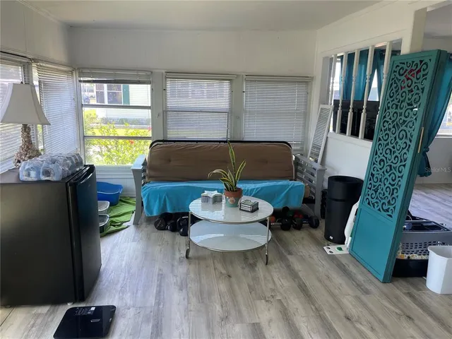 a living room with furniture fireplace and window