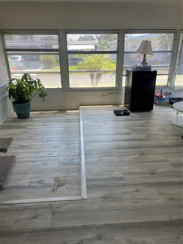 a view of a living room with a window