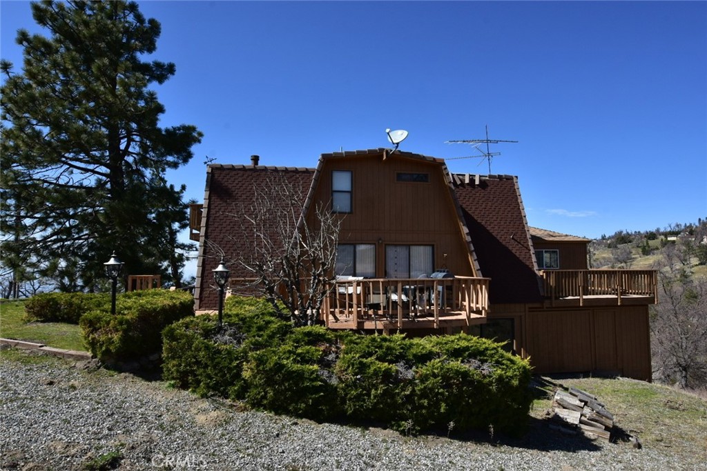 29551 Springwood Court Tehachapi, CA 93561 - Photo 15 of 19 a front view of a house with a yard