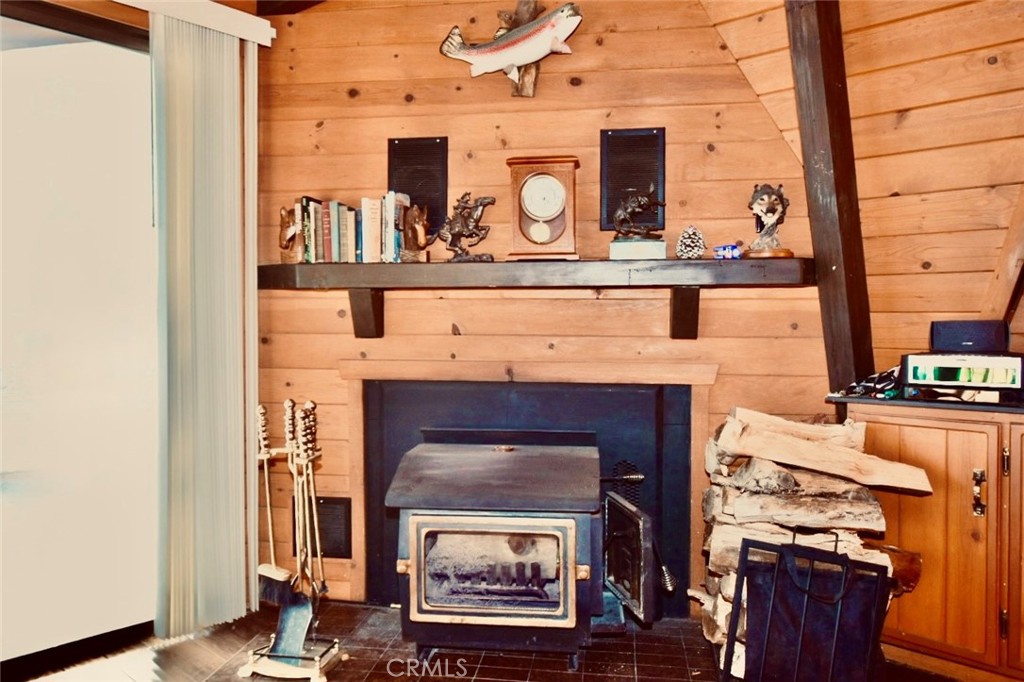 29551 Springwood Court Tehachapi, CA 93561 - Photo 5 of 19 a living room with furniture and a fireplace