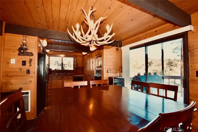 a bed room with a bed and a large window