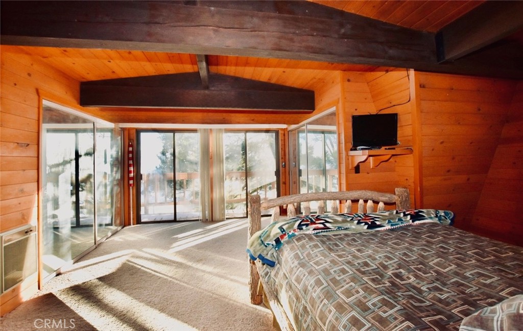 29551 Springwood Court Tehachapi, CA 93561 - Photo 9 of 19 a bed room with a bed and a large window