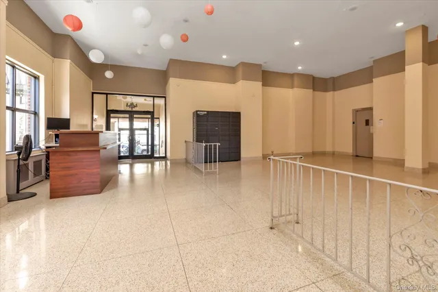 a view of an empty room with a chandelier
