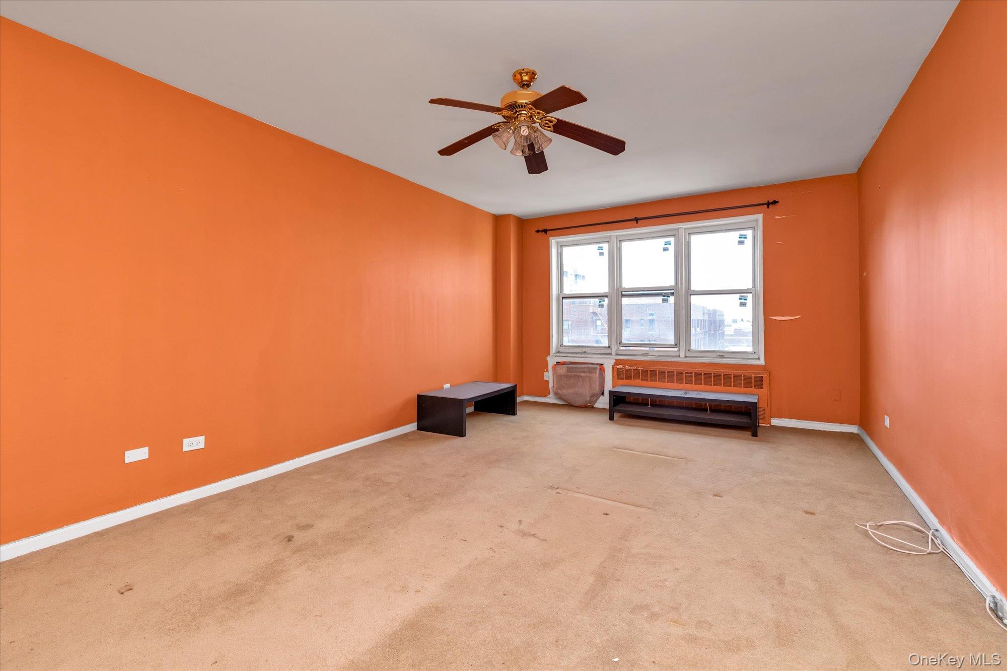 134-54 Maple Avenue, Unit 6M Queens, NY 11355 - Photo 3 of 15 a view of room with window and ceiling fan