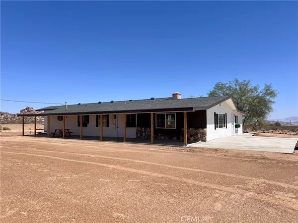 a front view of a house with a patio