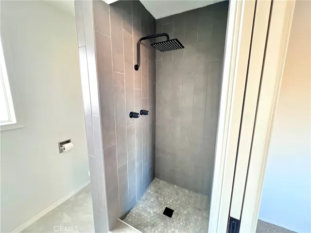 a bathroom with a glass shower door