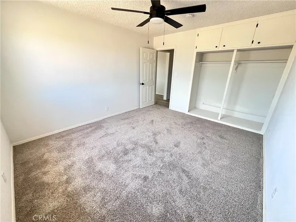 a view of a refrigerator in a kitchen
