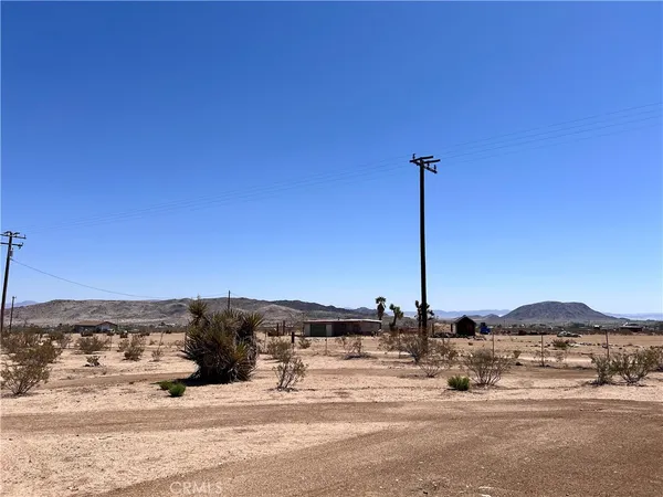 a view of a road with a building in the background