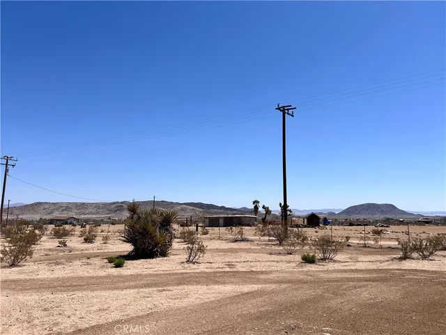 a view of a road with a building in the background