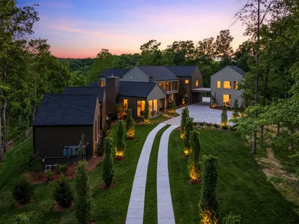 a front view of house and yard with green space