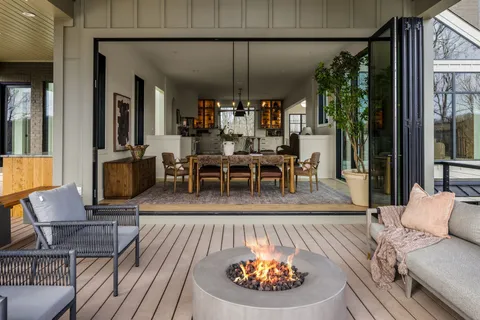 a living room with furniture rug and window