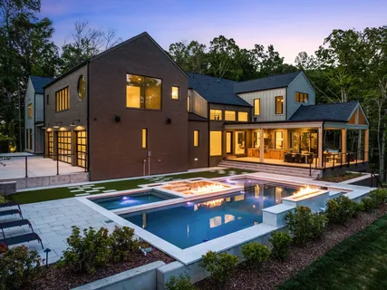 an aerial view of a house with mountain view